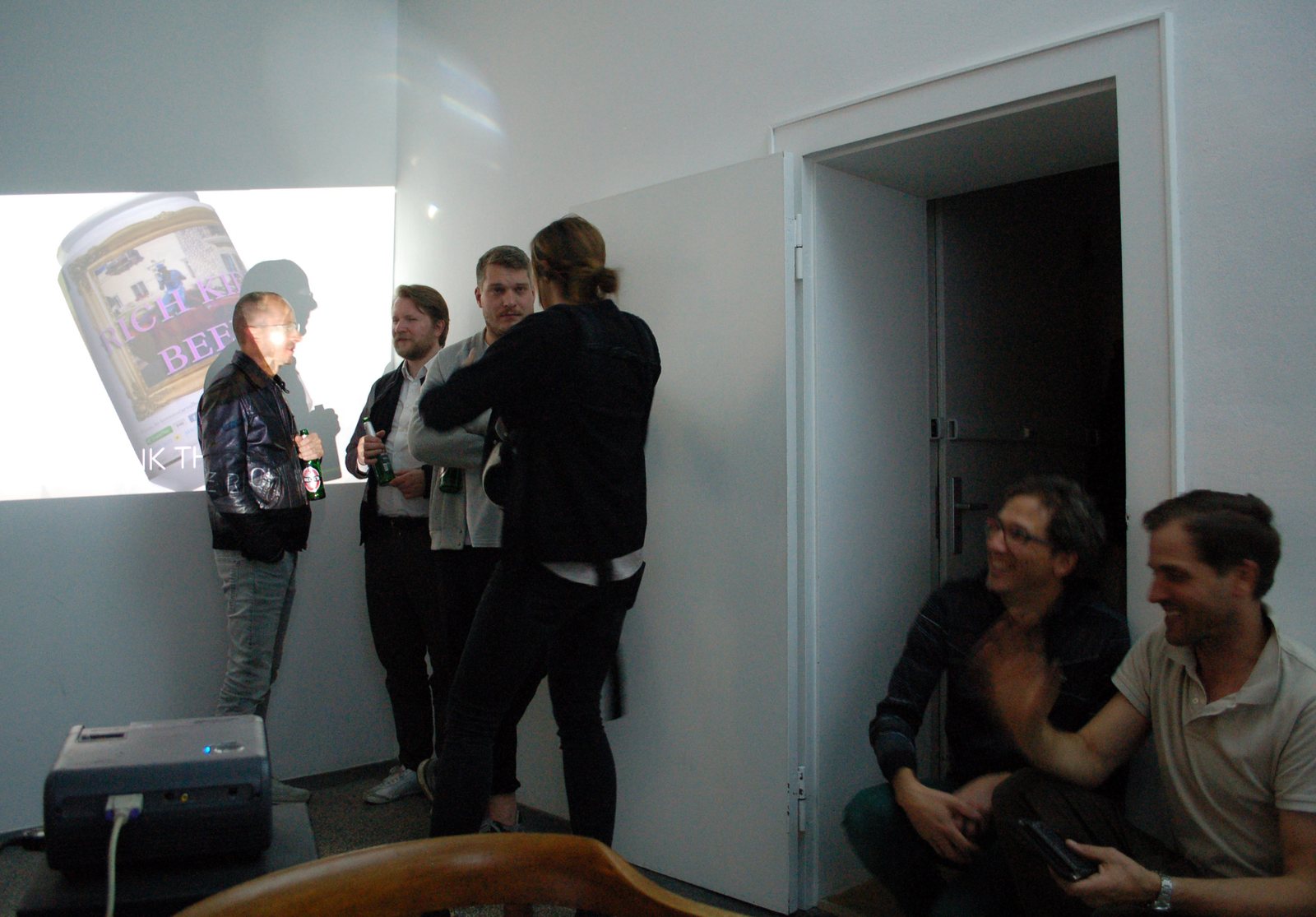 Inside THE HUB during an event — projection and audience